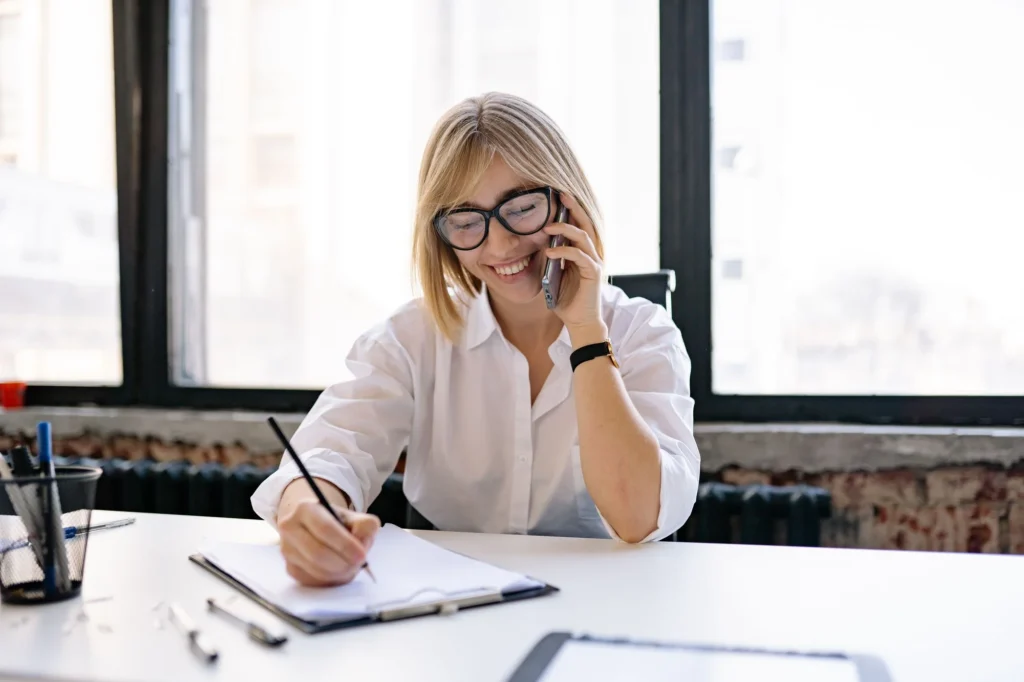 Taking notes during a phone call about a business profile problem